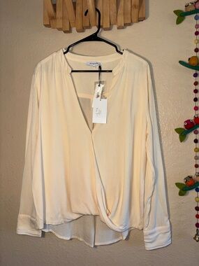 NWT Olivaceous brand women's blouse, featuring a V-neck and wrap-style front